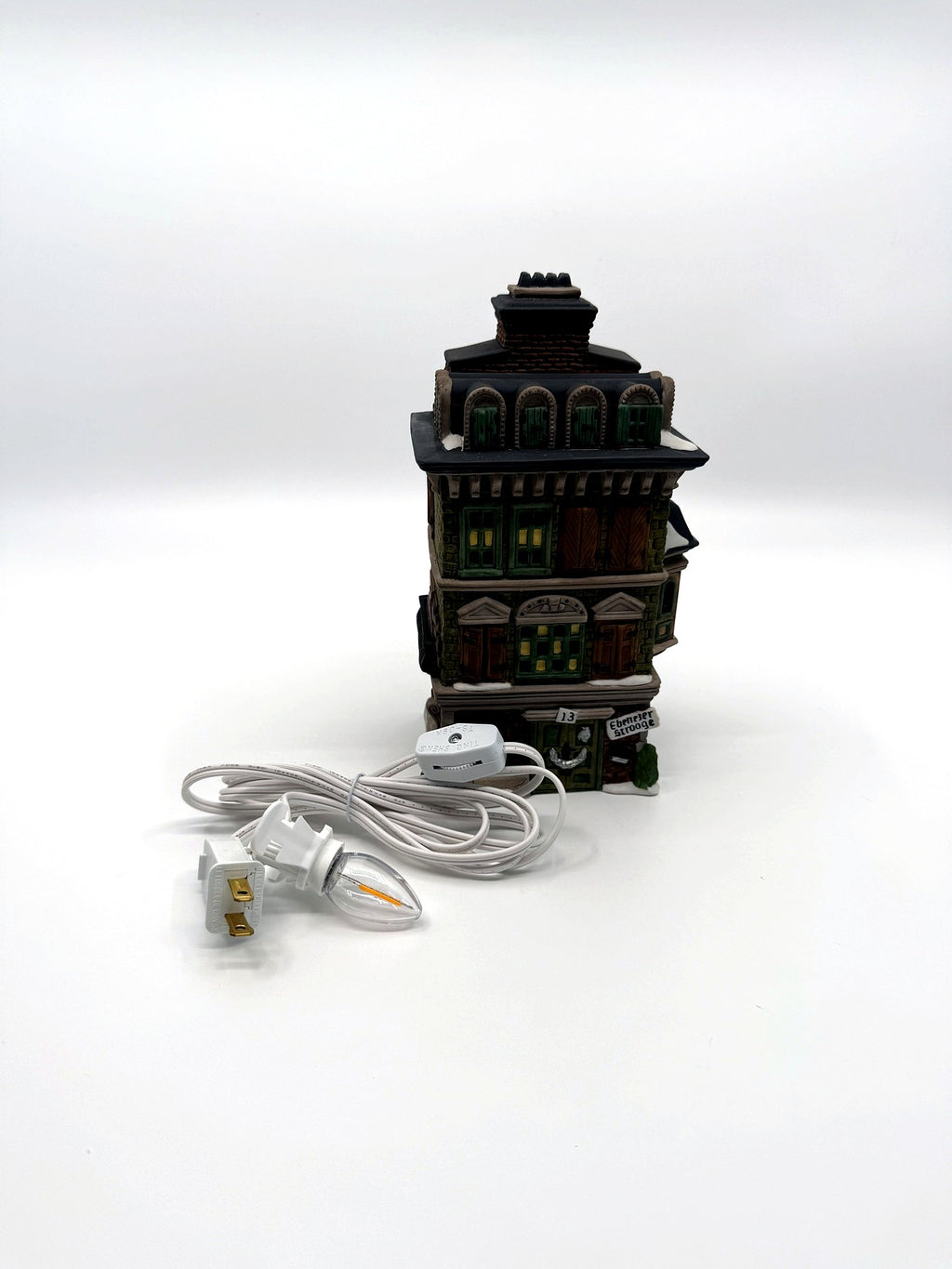 The Flat of Ebenezer Scrooge with its new replacement light cord and bulb (enhanced)