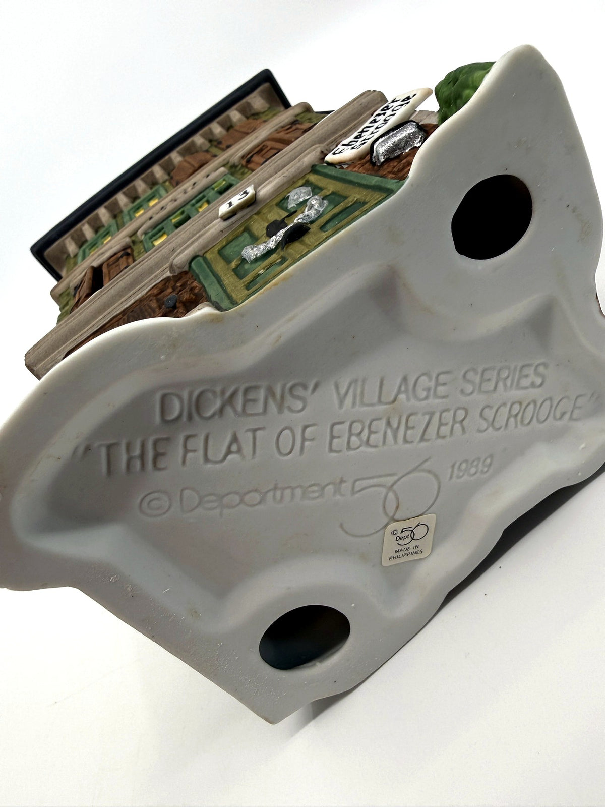 The Flat of Ebenezer Scrooge underside, molded series stamp dated 1989 (enhanced)