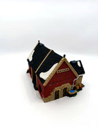 Department 56 Dickens' Village Butter Tub Barn #58338 – side angle with water trough, barrels and sacks