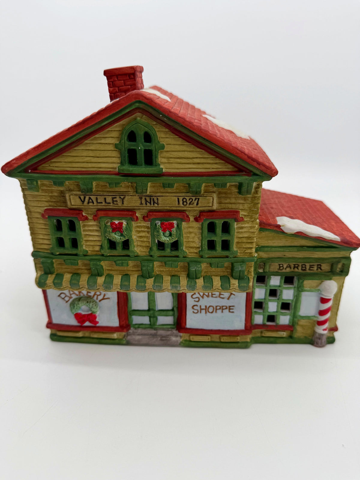 Front detail - Valley Inn 1827 sign, Christmas wreaths, Bakery and Sweet Shoppe storefronts