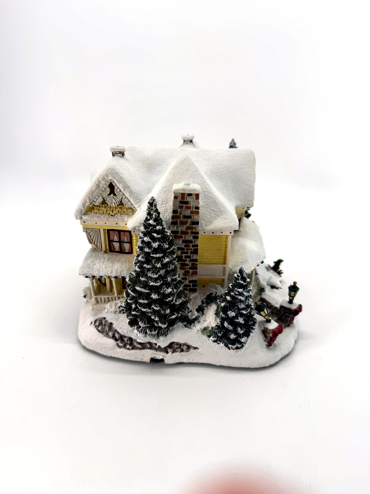 Victorian Homestead - side view with stone chimney and evergreens