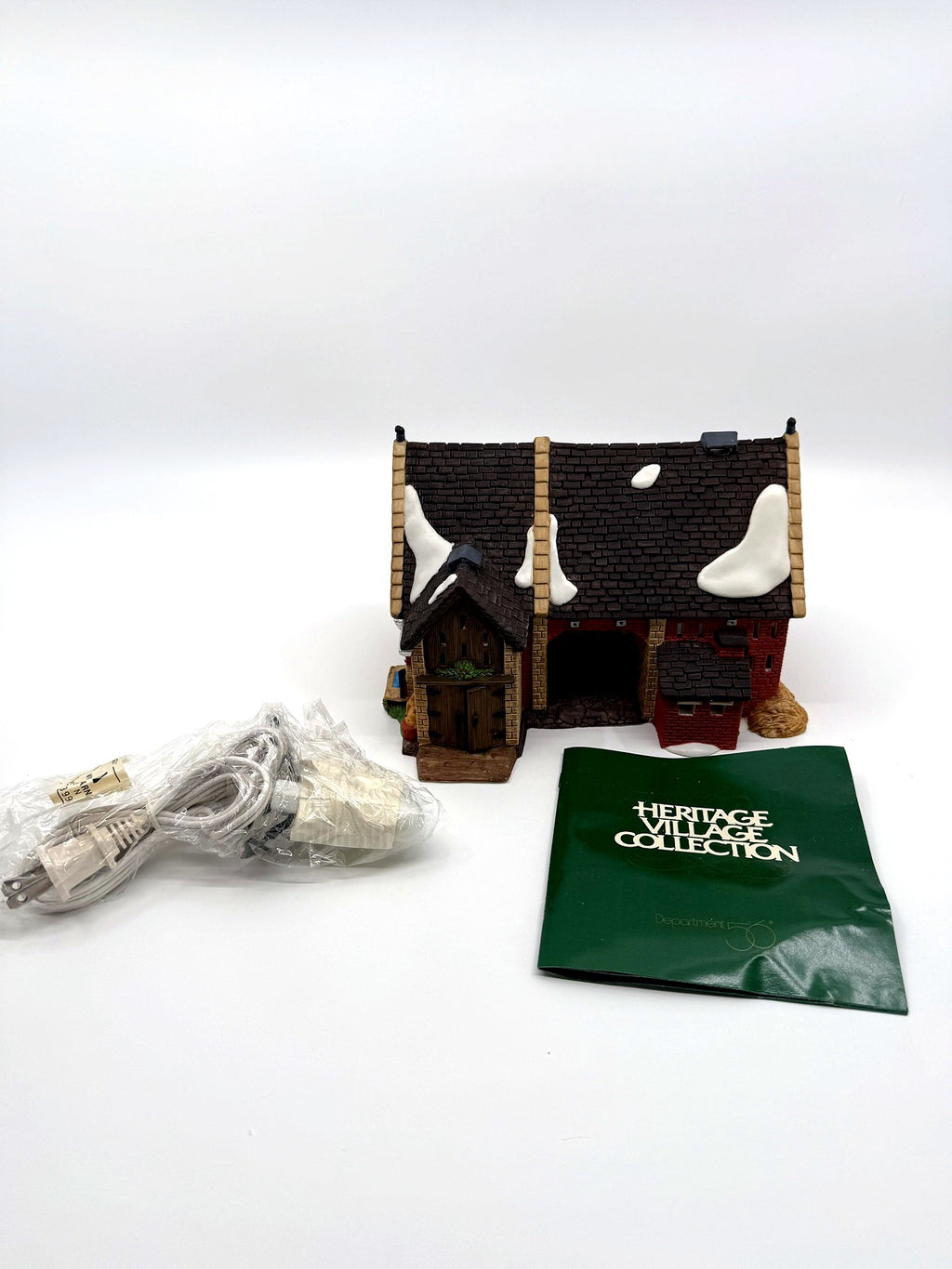 Department 56 Dickens' Village Butter Tub Barn #58338 – the building with its original light cord still sealed in packaging and the Heritage Village Collection literature booklet