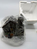 Whittlesbourne Church in plastic beside its Styrofoam packaging (enhanced)
