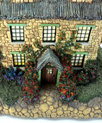 Detail - Stonebrooke Inn stone facade, roses and front door
