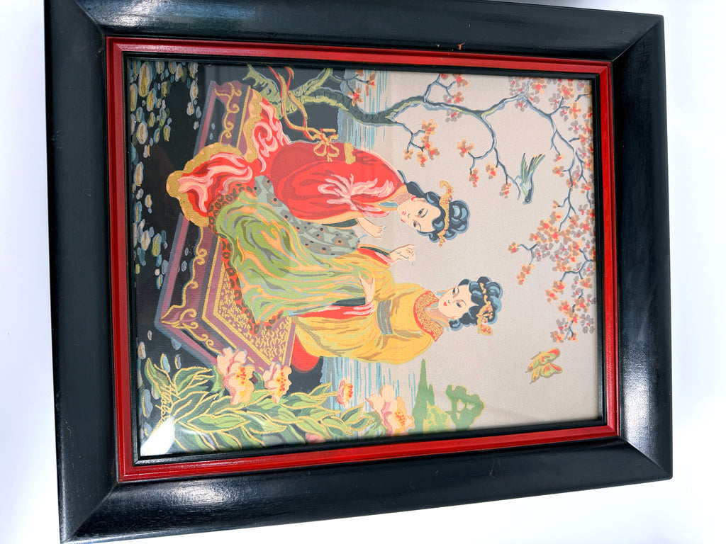 Vintage Asian figural textile art — signed framed pair — one panel photographed at an angle — the two musicians