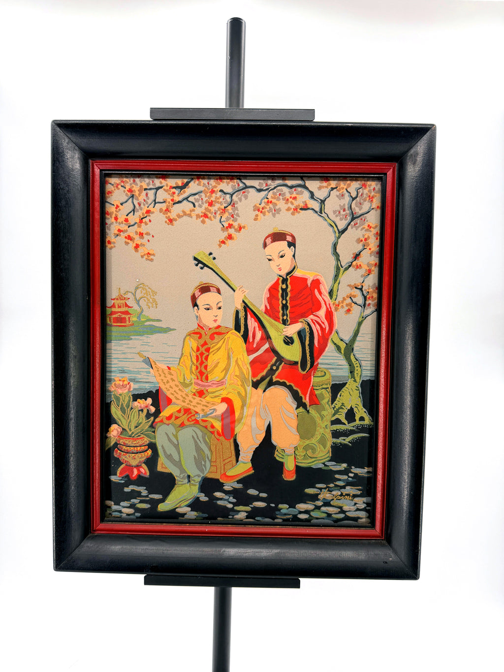 Vintage Asian figural textile art — signed framed pair — the musicians panel on a stand, front view