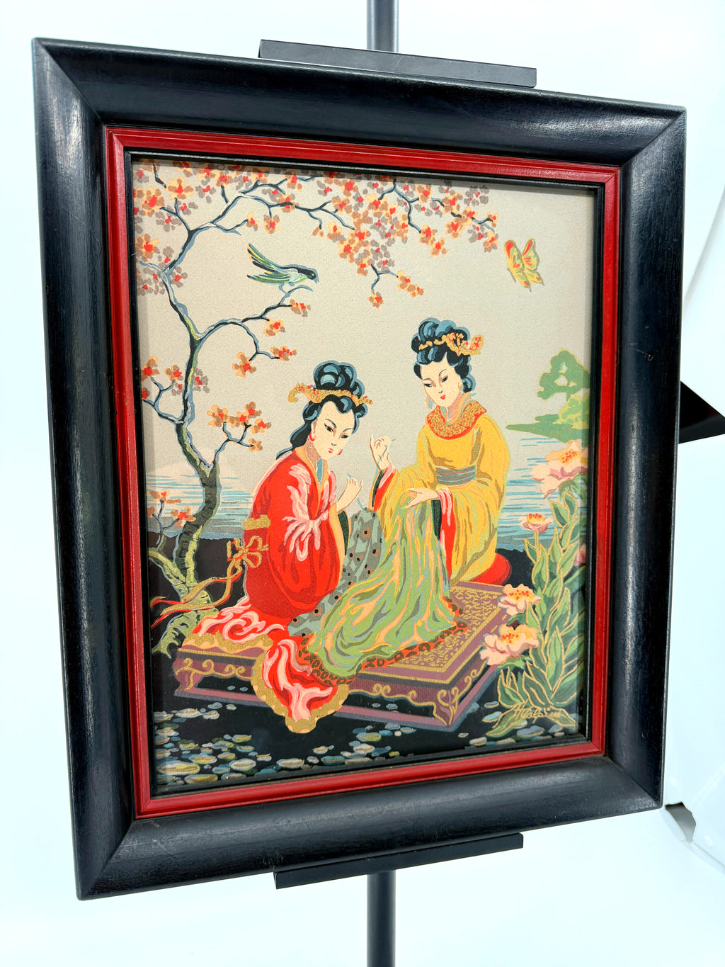 Vintage Asian figural textile art — signed framed pair — the two-women panel at an angle, closer view