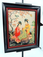 Vintage Asian figural textile art — signed framed pair — the two-women panel at an angle, closer view