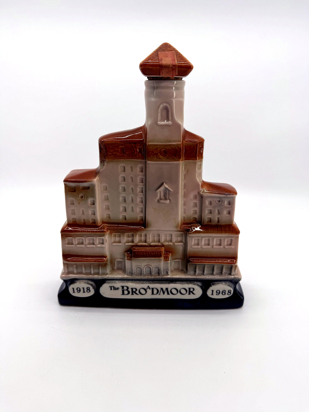 Back of the Broadmoor decanter with The Broadmoor 1918-1968 anniversary plaque