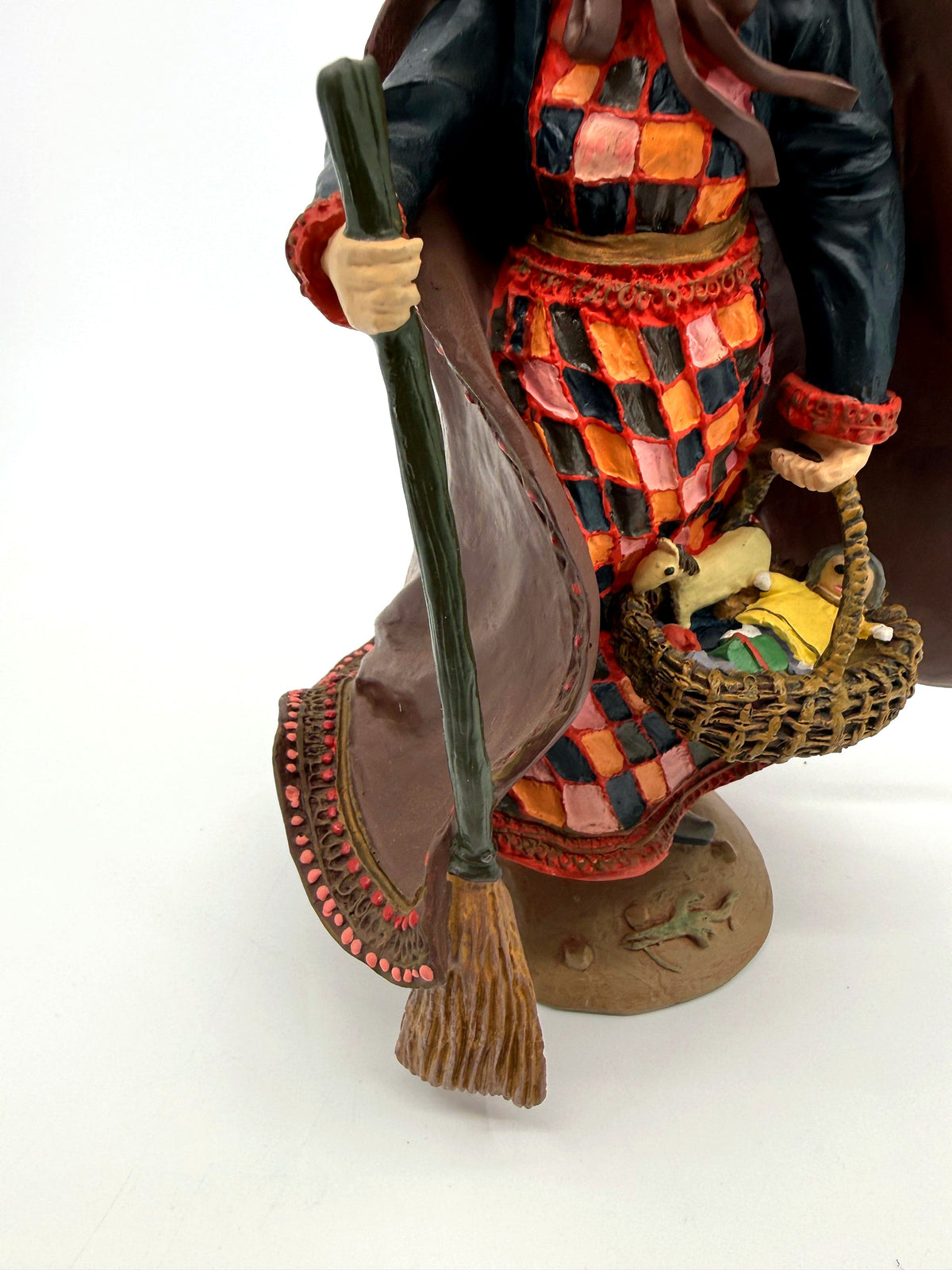 Befana front close view, broom, patchwork dress and basket (enhanced)