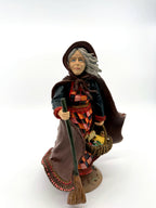 Befana front view, hooded cape and patchwork dress (enhanced)