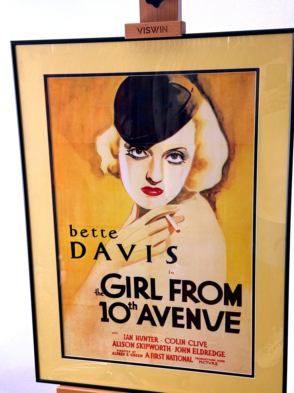 Framed Bette Davis movie poster front view with black frame and gold-toned matting