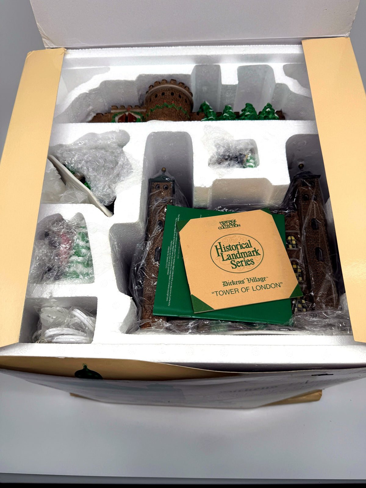 Department 56 Tower of London, Dickens' Village Historical Landmark Series, 1997 – open original box with the porcelain pieces in their protective Styrofoam packaging, literature and light cord
