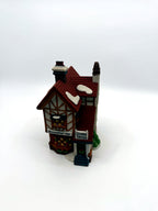 Front angle view with the Bumpstead Nye and Cloaks Canes shop signs