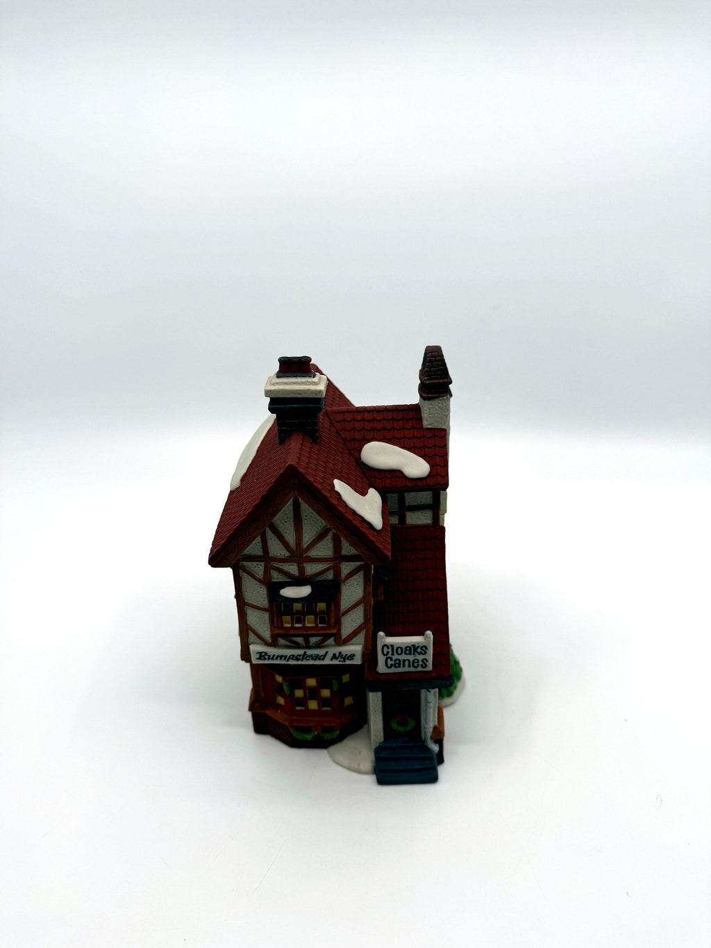 Front view from above showing the roofline and tall brick chimney