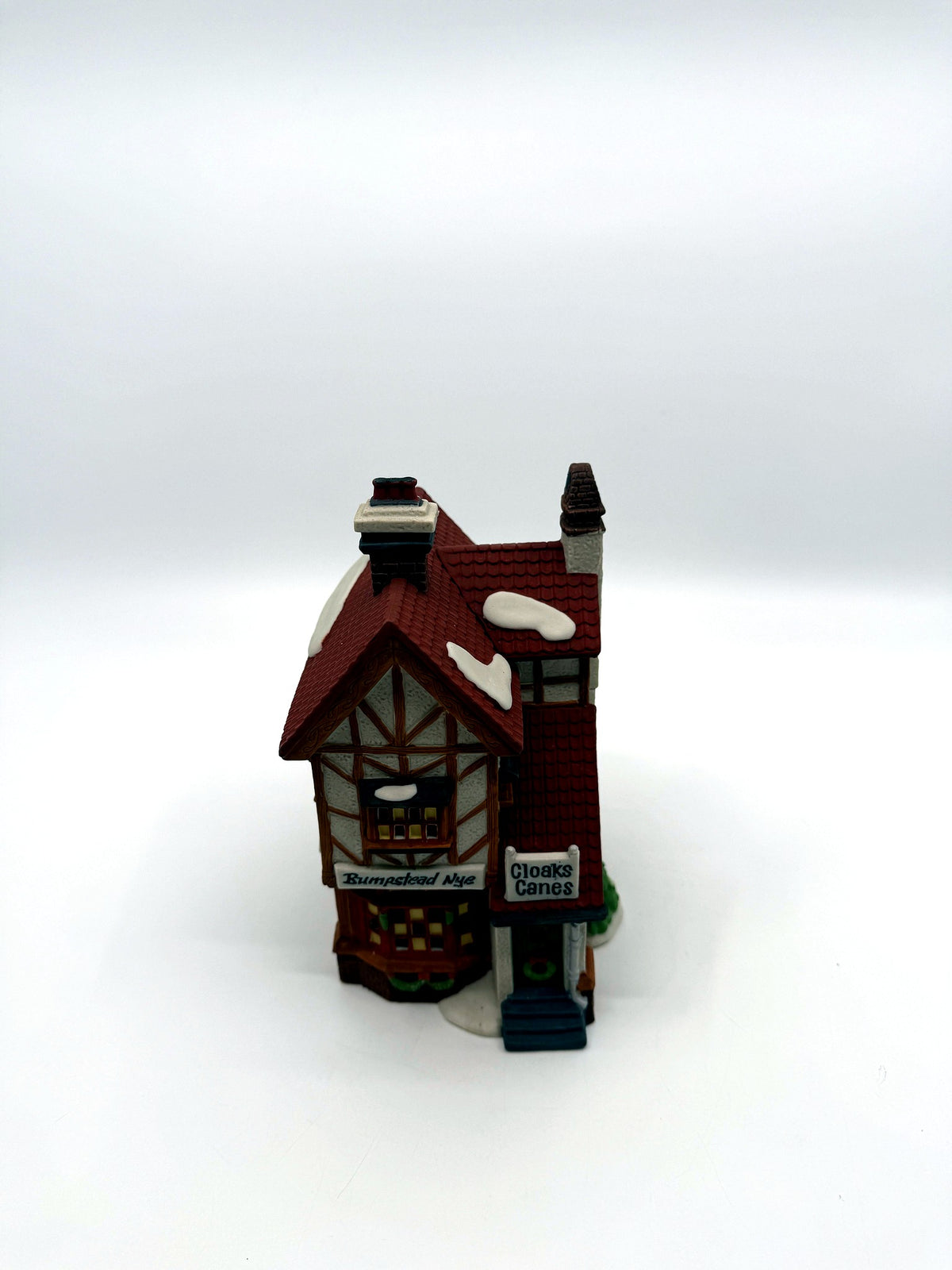 Front view from above showing the roofline and tall brick chimney