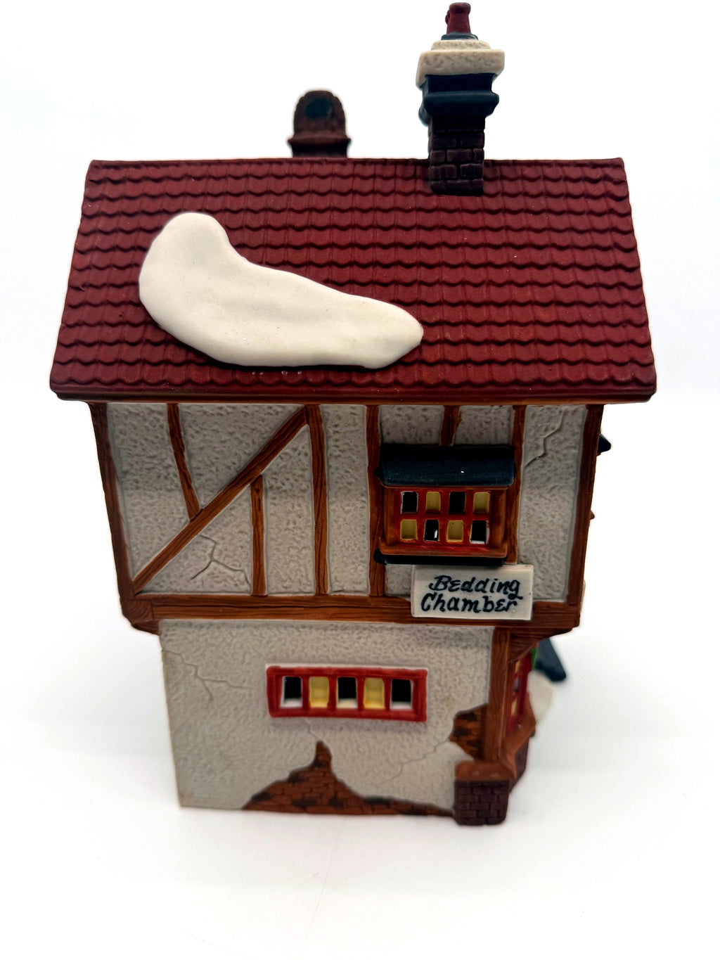 Side view with the Bedding Chamber sign and large roof snow patch