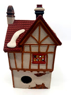 Back view showing the half-timbered gable and lighting cord opening