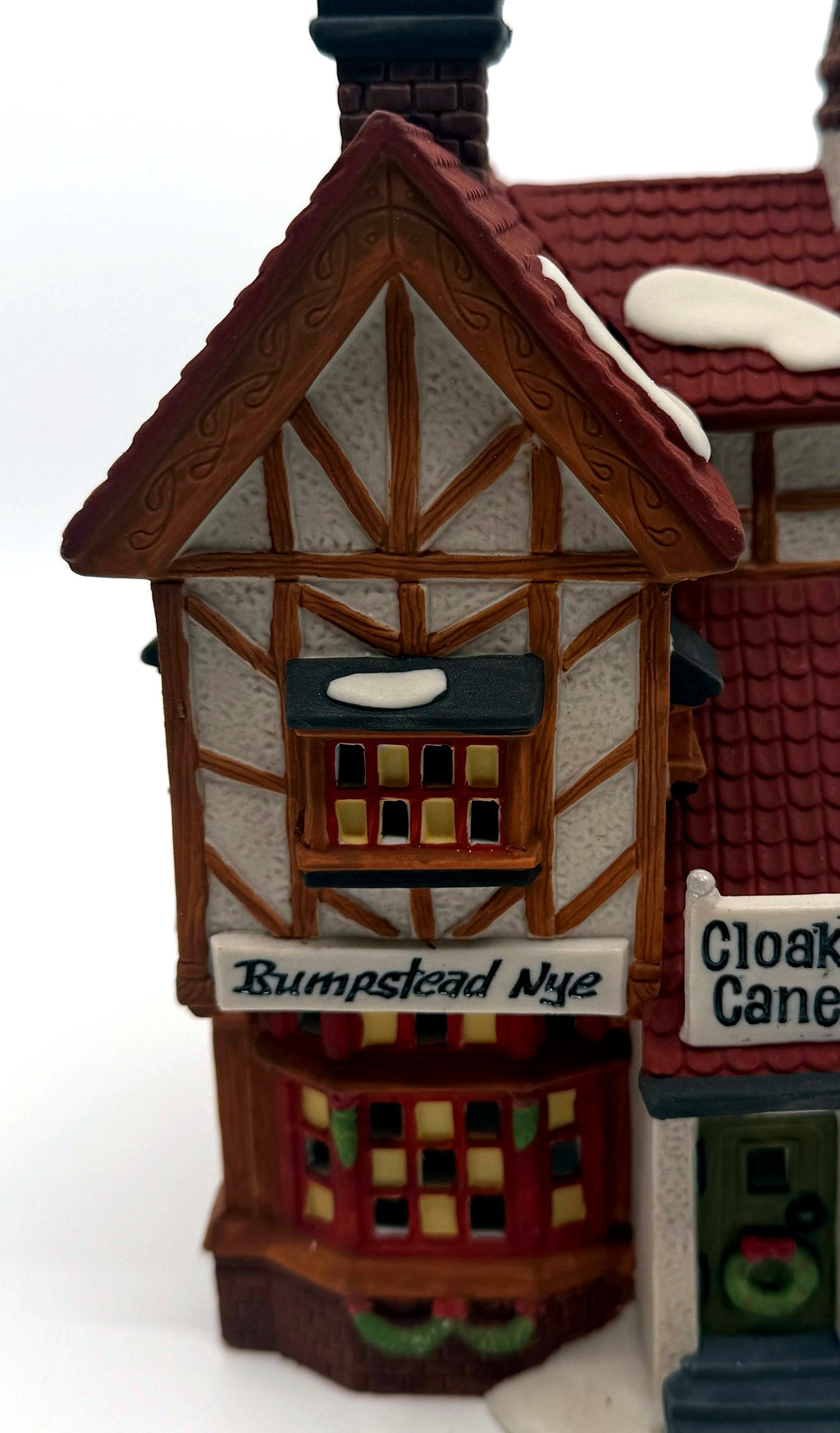 Detail of the timbered gable and glowing bay window