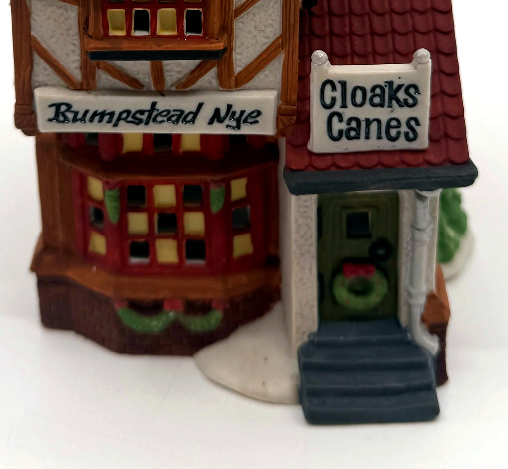 Detail of the hand-painted Bumpstead Nye and Cloaks Canes signs above the shop door