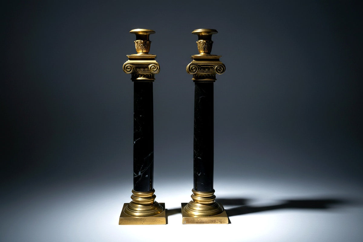 Vintage pair of brass and black marble neoclassical candlesticks