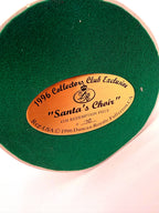 Underside: gold identification label on green felt, 1996 Collectors Club Exclusive, Santa's Choir, 4th Redemption Piece No. 100 (enhanced)