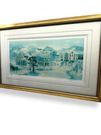 Will Moses "School House Pond" lithograph — angled front view from the right, showing the gold frame profile and the village scene