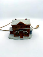 Lighted ceramic Christmas village country store, straight front view with cord and plug