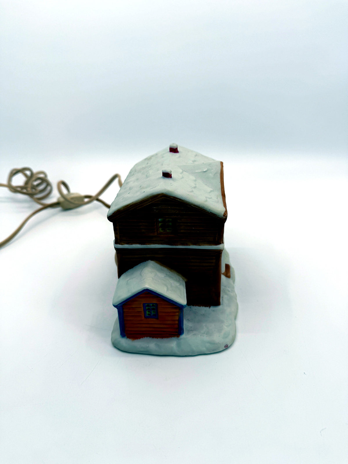 Lighted ceramic Christmas village country store, right side view with annex