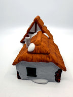 Right gable end with half-timbering and green attic window