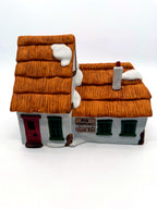 Front view, closer: red door, green windows and the Bob Cratchit and Tiny Tim plaques