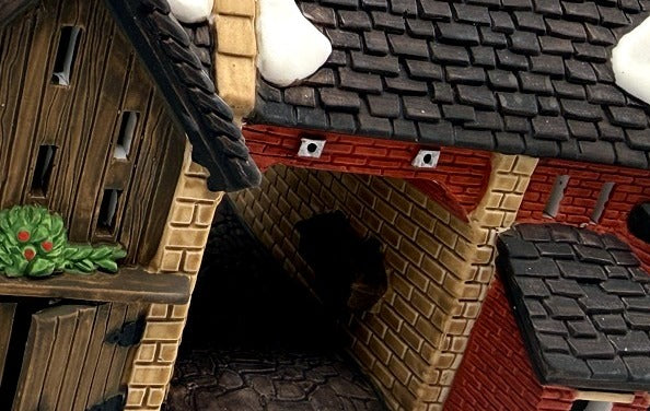 Department 56 Dickens' Village Butter Tub Barn #58338 – detail: the covered archway passage through the building, brick and stone interior