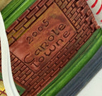 Close-up of the back emboss reading 2005 Carole Towne