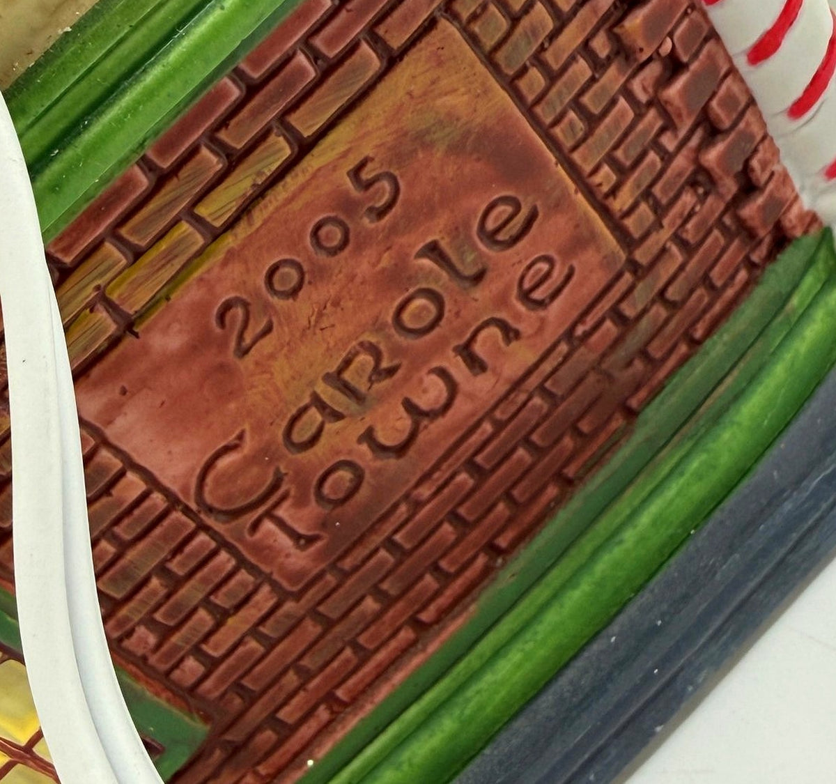 Close-up of the back emboss reading 2005 Carole Towne