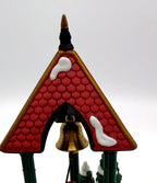 Department 56 Christmas Bells, 1996 Special Event Piece, Heritage Village Collection – detail: scalloped red shingle roof and polished brass bell
