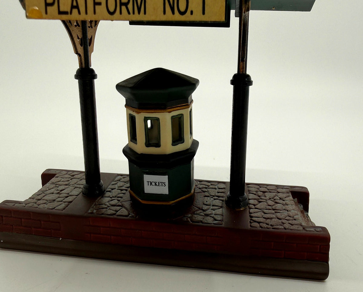 Detail crop: the octagonal ticket booth with its TICKETS sign (enhanced photo)