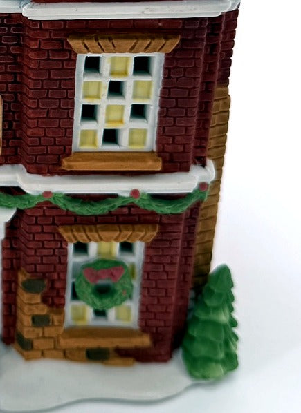 Department 56 Dickens' Village Boarding & Lodging School 1993 #5809-2 – 150th Anniversary of A Christmas Carol Commemorative Edition, No. 18 – detail of the hand-painted brickwork, windows and Christmas wreath