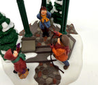 Department 56 Christmas Bells, 1996 Special Event Piece, Heritage Village Collection – detail: the three children ringing the bell, cobblestone path