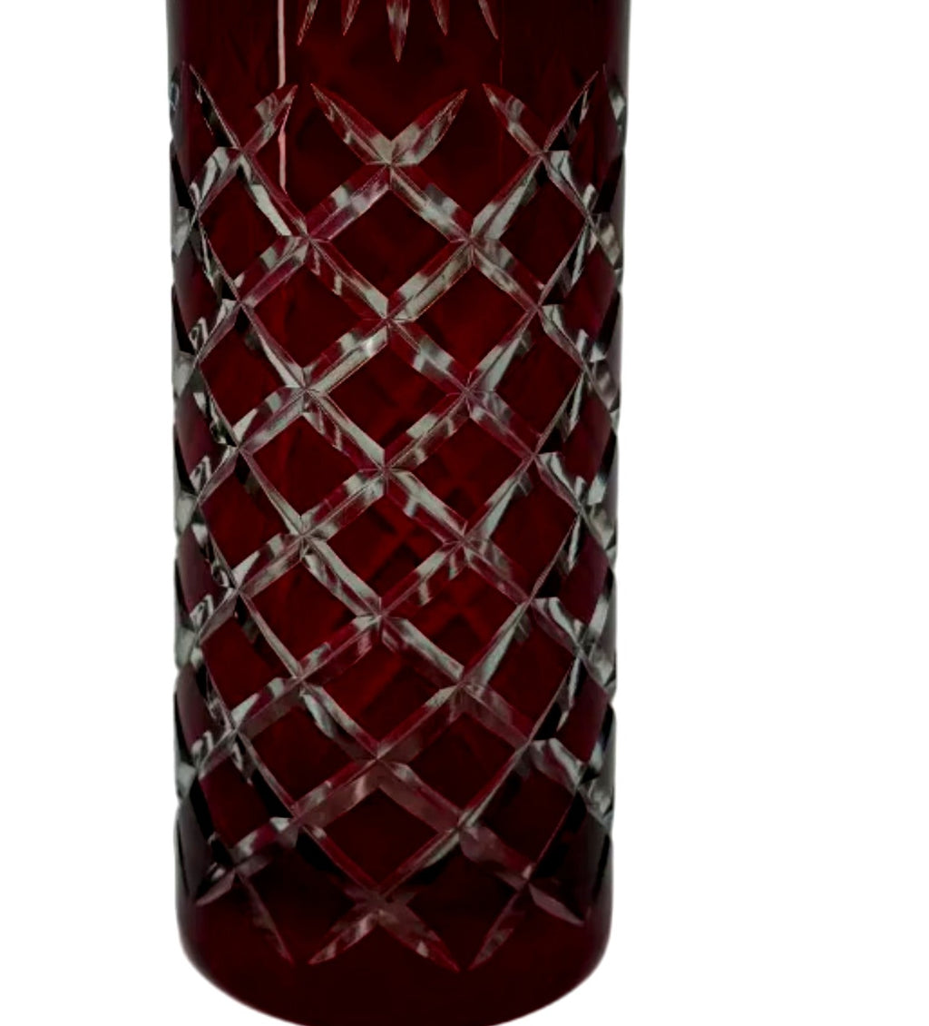 Close-up detail — the diamond crosshatch cutting revealing clear glass beneath the ruby red overlay