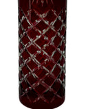 Close-up detail — the diamond crosshatch cutting revealing clear glass beneath the ruby red overlay