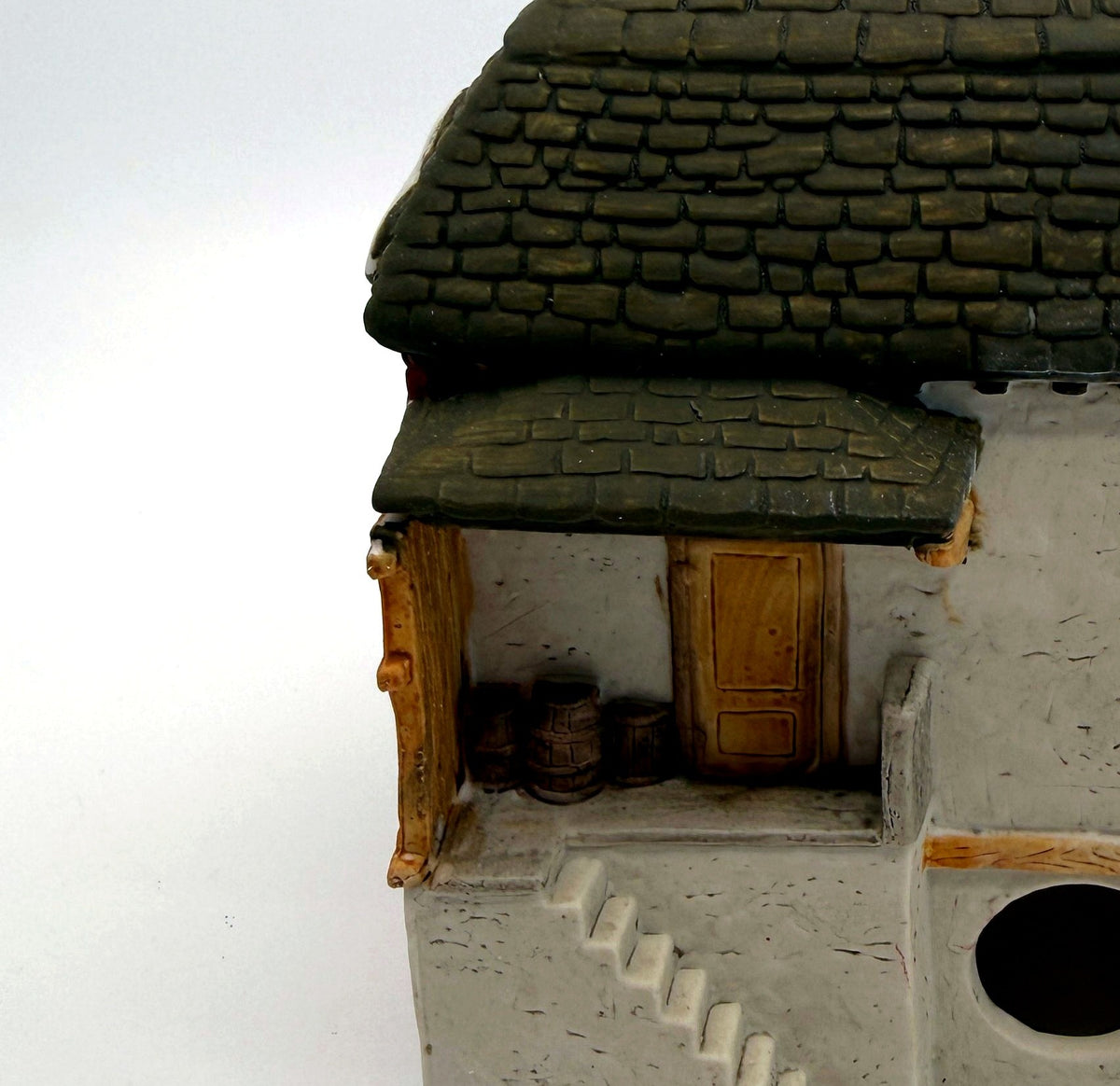 Department 56 M. Fezziwig Warehouse, Dickens' Village, 1986 – detail: rear loading dock with barrels and stairs