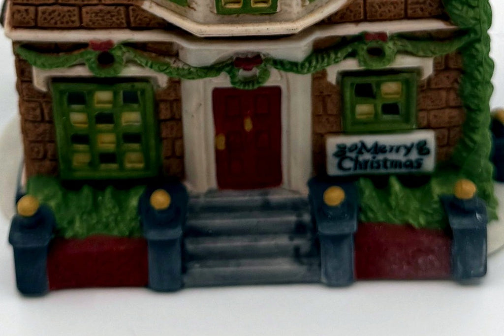 Department 56 Nephew Fred's Flat, Dickens' Village, 1991 – detail: front door, garland and Merry Christmas sign