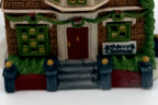 Department 56 Nephew Fred's Flat, Dickens' Village, 1991 – detail: front door, garland and Merry Christmas sign