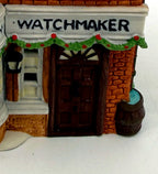 Detail - Watchmaker sign, garland and front door