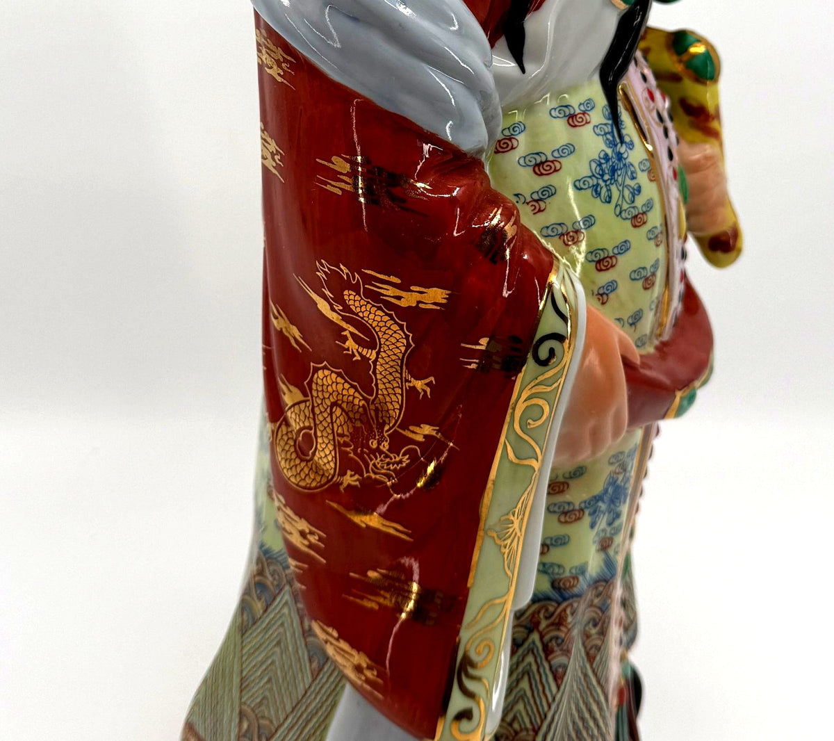 Vintage Chinese porcelain Lu Xing prosperity god statue, Taiwan — detail: gold dragon on the coral-red sleeve