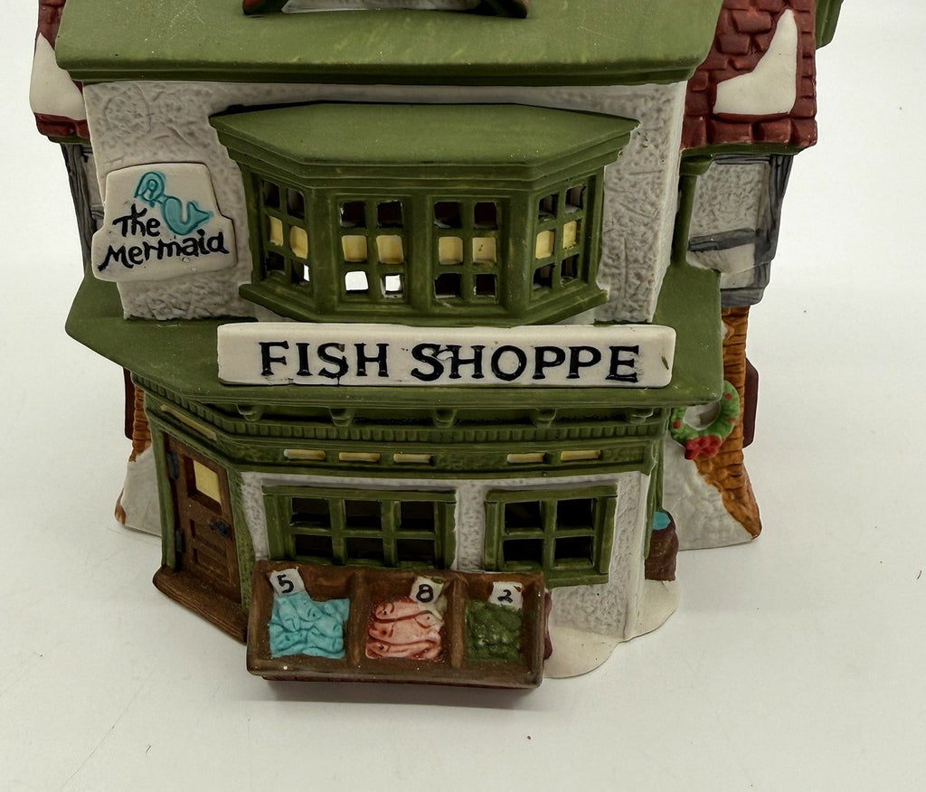 Department 56 Dickens' Village The Mermaid Fish Shoppe #5926-9 — detail: The Mermaid sign, bay window, and FISH SHOPPE storefront sign