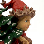 Detail: The Pixie face, blue eyes and fur-trimmed red cap (detail from seller photo)