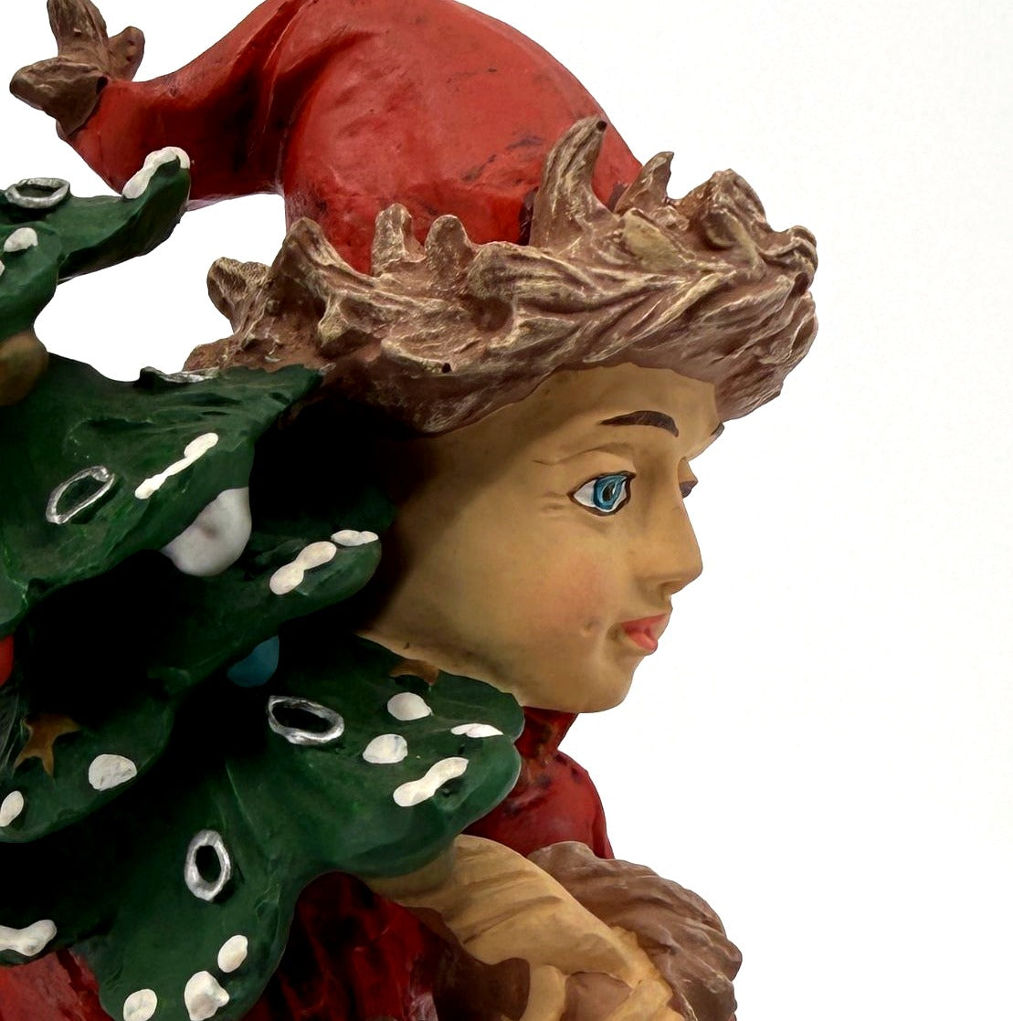 Detail: The Pixie face, blue eyes and fur-trimmed red cap (detail from seller photo)