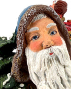 Detail crop — Winter Santa’s hand-painted face, blue eyes and flowing white beard
