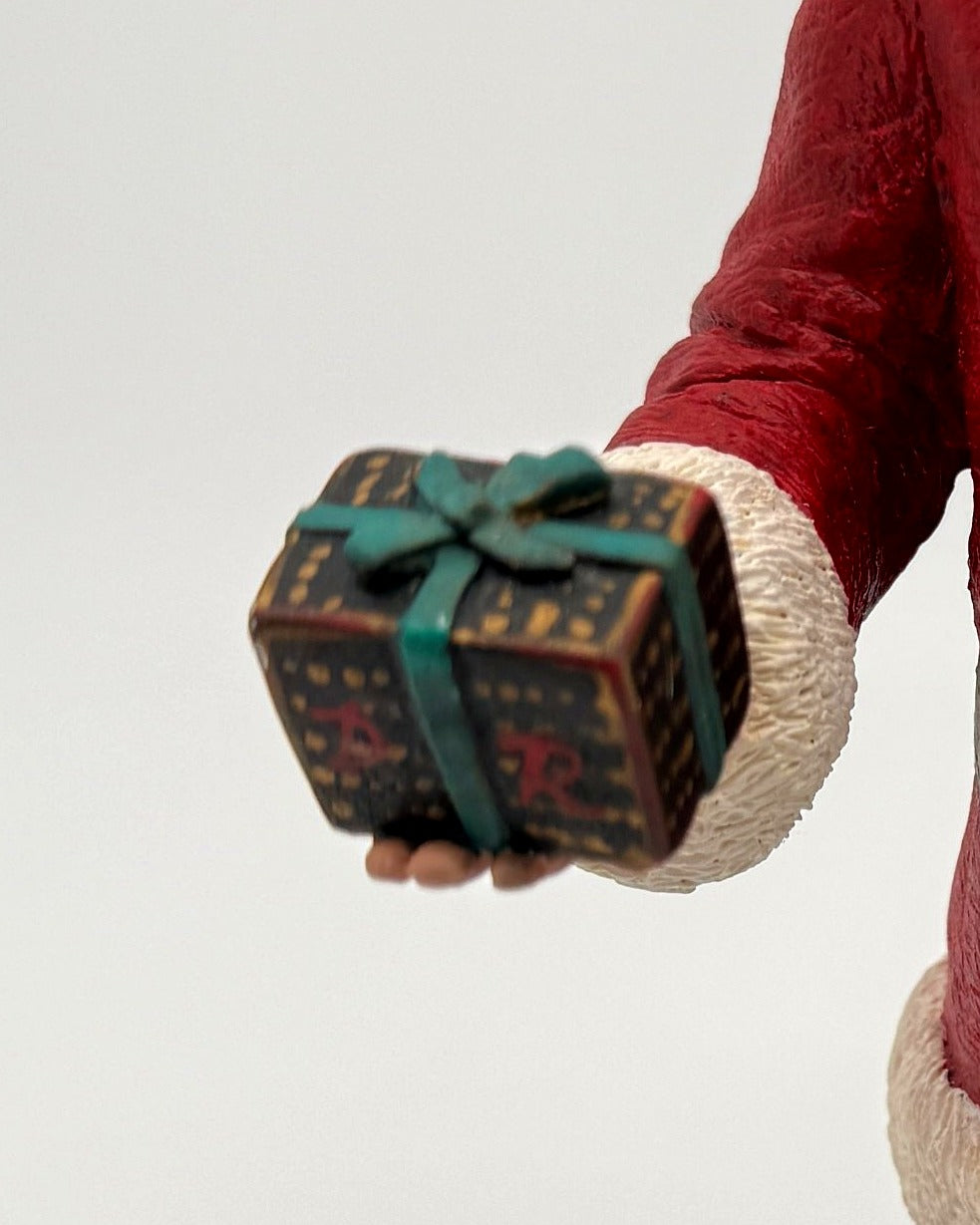 Vintage 1994 Duncan Royale Santa's Gift figurine – detail of the wrapped Christmas present in Santa's hand